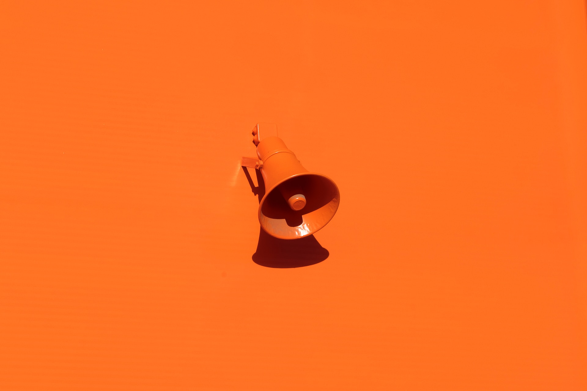 The Power of First Impressions: Why Your Landing Page Matters Picture of a very orange megaphone