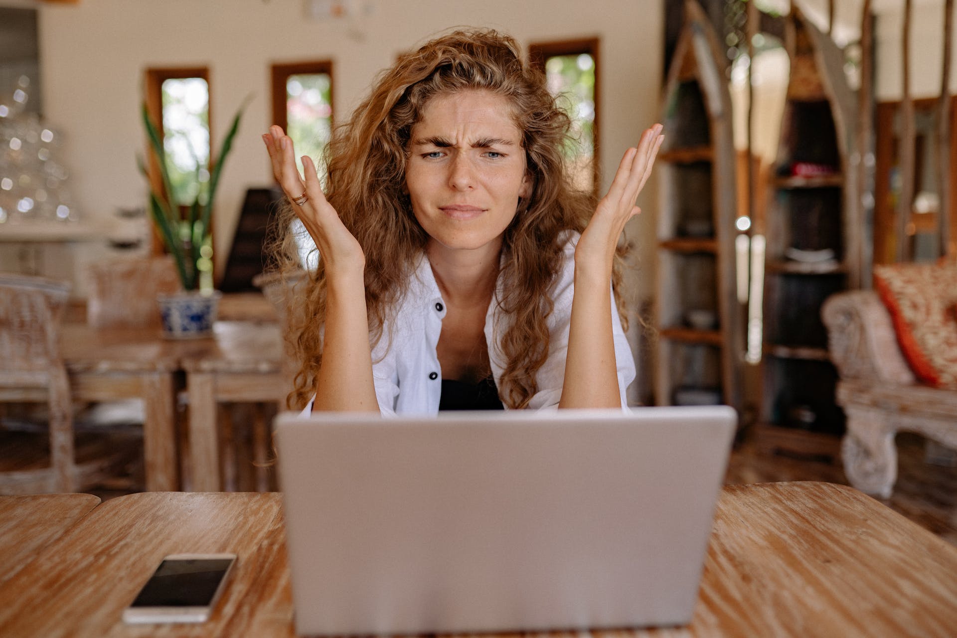 Technophobe: a woman frustrated at her laptop