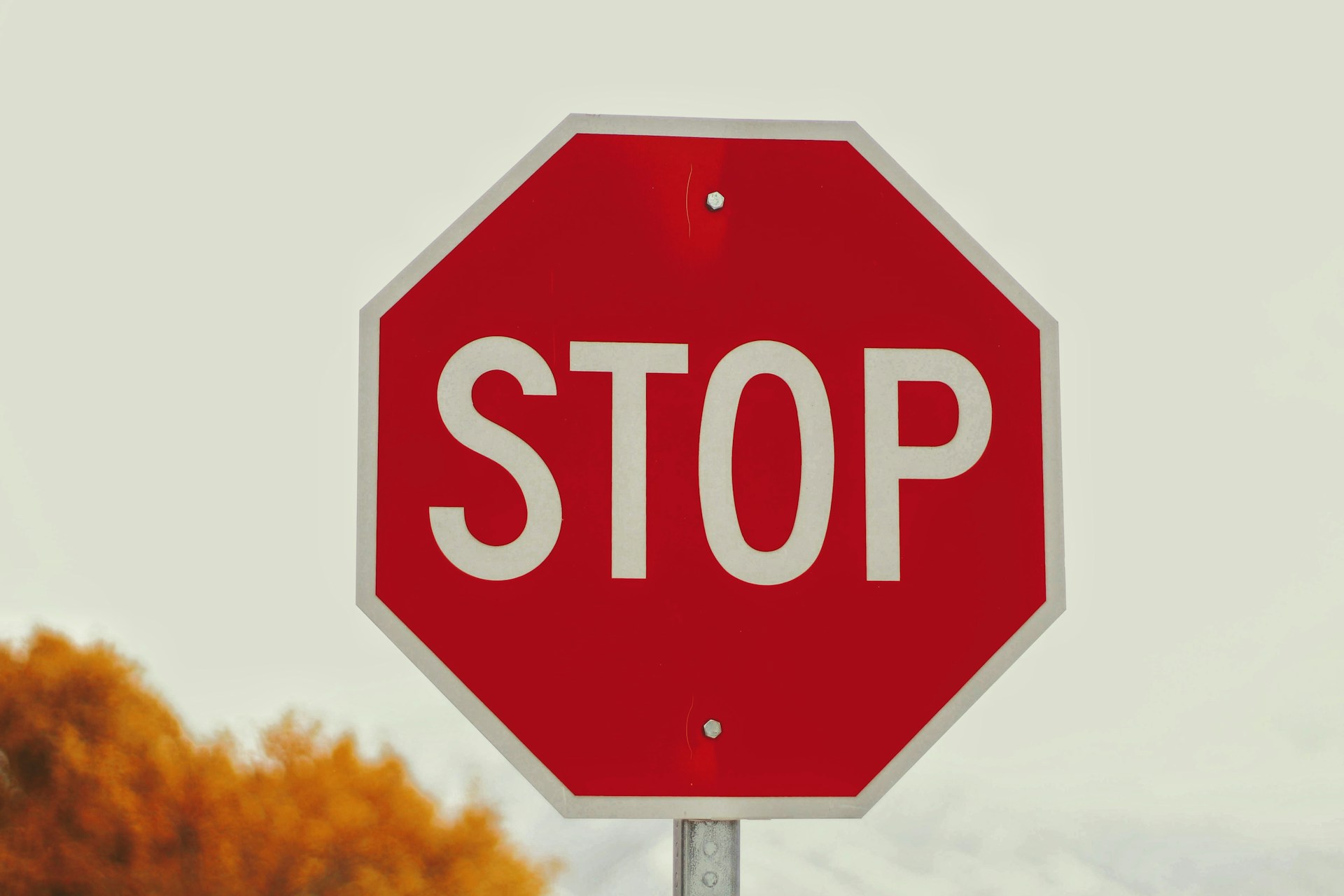 Picture of a stop sign: stop wasting your time on your brand haters and instead focus on converting customers into fans