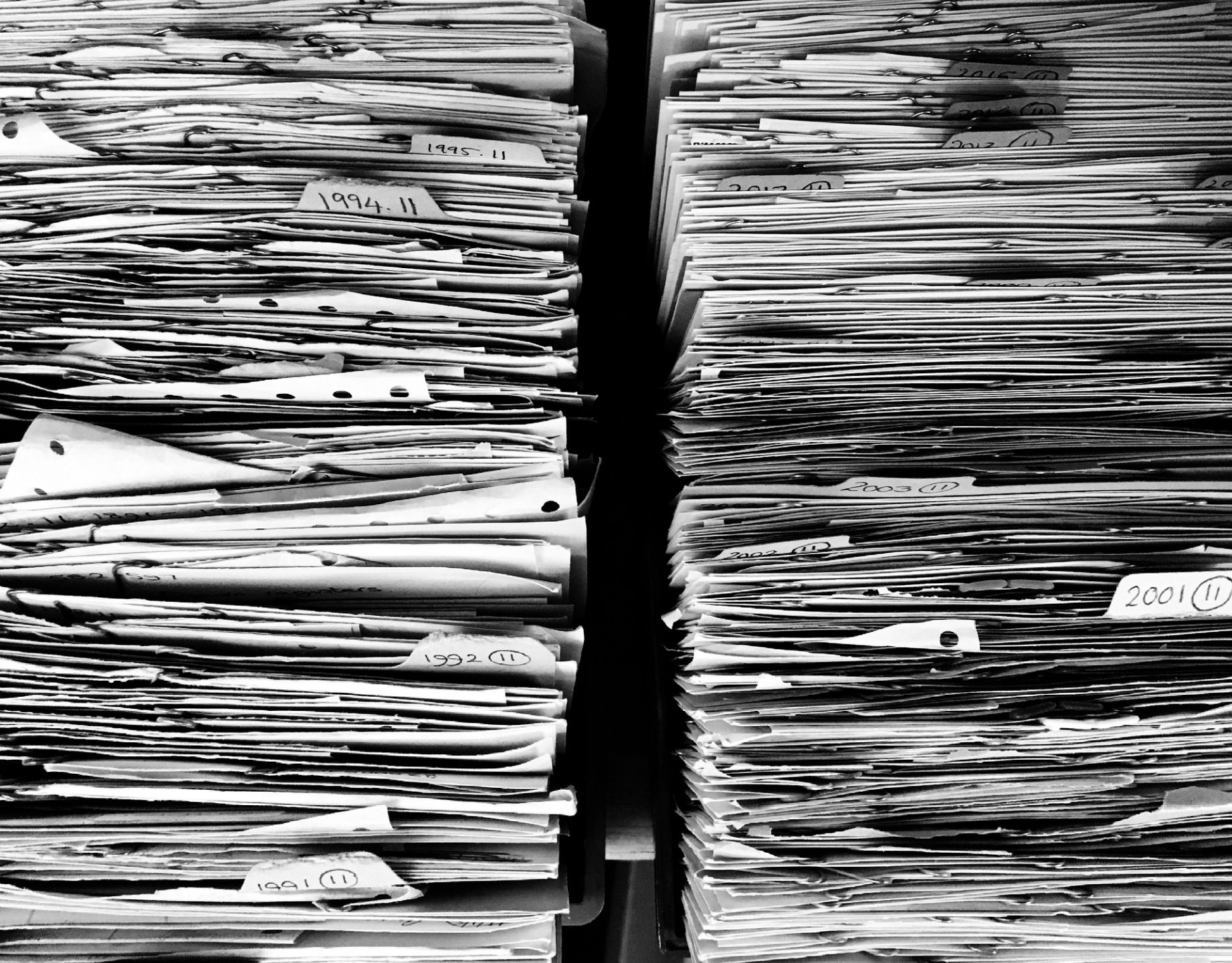 Picture of two, large, stacks of paper - how data gathering USED to be done!